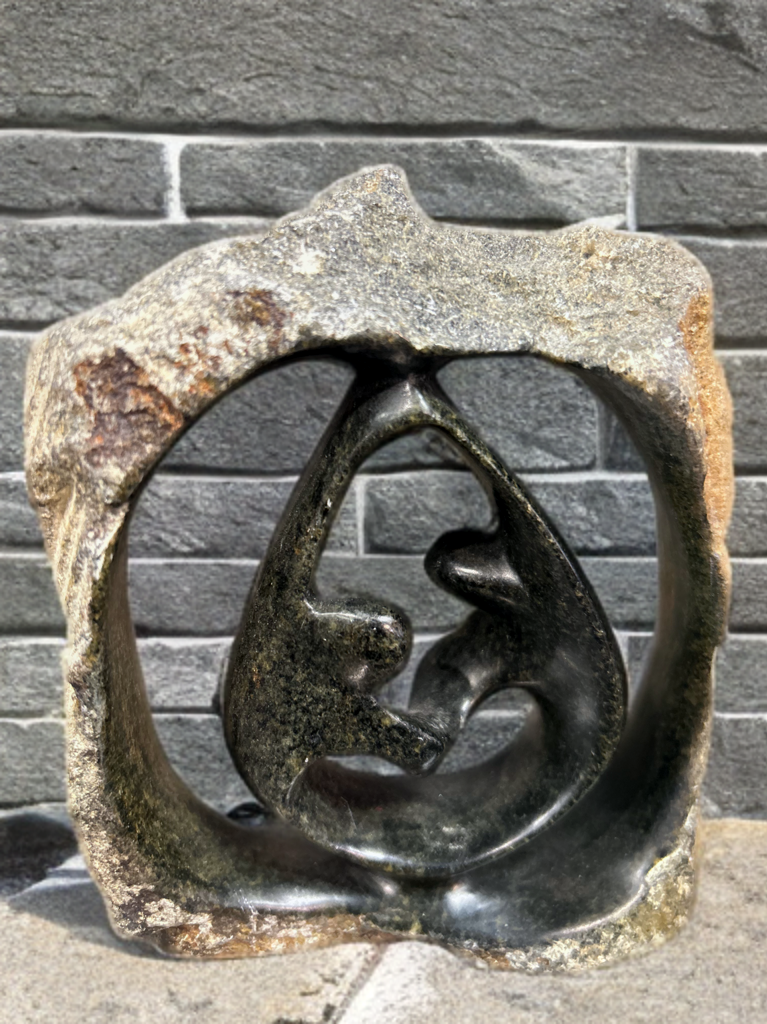 African Crafted Couple Dancing under a Stone Carved Shelter