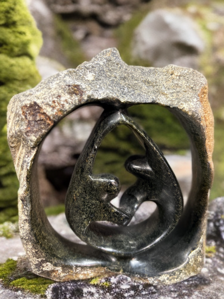 African Crafted Couple Dancing under a Stone Carved Shelter