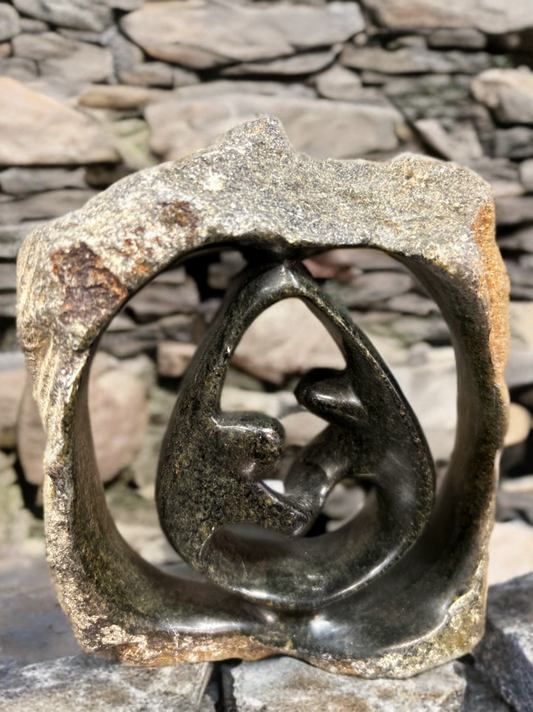 African Crafted Couple Dancing under a Stone Carved Shelter