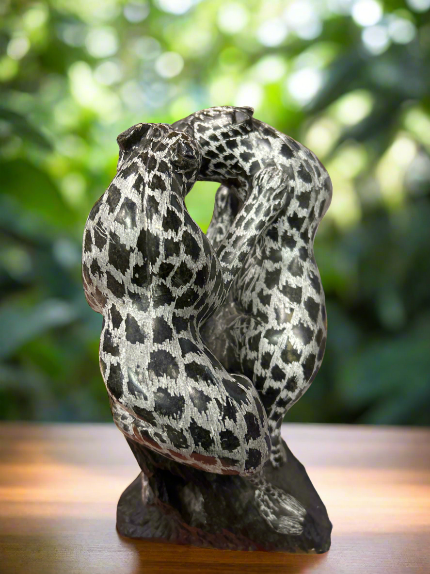 African Stone Crafted Leopards Feeding on a Stone Crafted African Tree