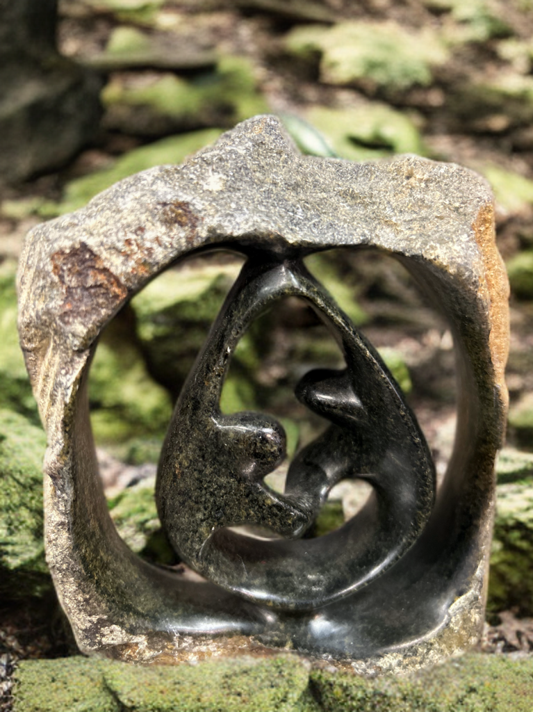 African Crafted Couple Dancing under a Stone Carved Shelter